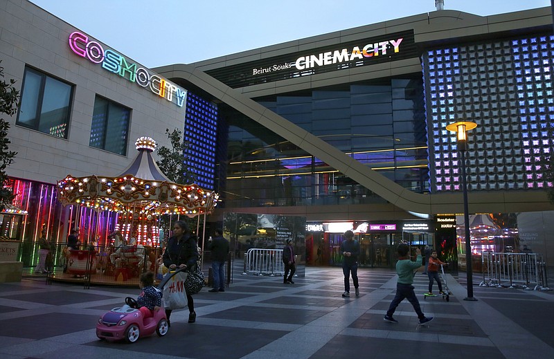 
              People walking in front of the Cinema City complex in downtown Beirut, Lebanon, Tuesday, Jan. 16, 2018. Lebanon’s censorship authorities have effectively banned Steven Spielberg’s newspaper drama, “The Post,” because the American director is on a regional blacklist for supporting Israel. The directive by the country’s General Security agency still needs to be signed by Interior Minister Nouhad Machnouk to enter into effect, but that is considered a formality. (AP Photo/Bilal Hussein)
            