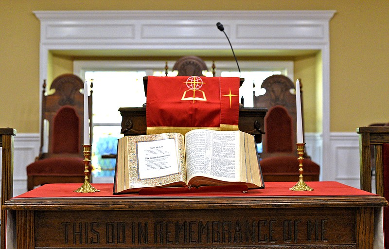 The Bible lies open before the pulpit at The Ark Church on Rawlings Street in East Chattanooga.