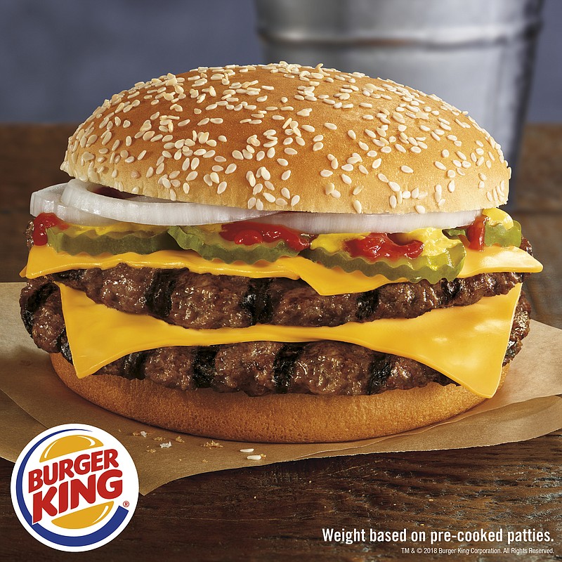 This photo provided by Burger King shows the restaurant's new Double Quarter Pound King burger. Burger King is looking to start a beef with McDonald's by launching its own quarter pound burger. The fast food company says the Double Quarter Pound King will hit restaurants nationwide Thursday, Jan. 18, 2018. (Burger King Corp. via AP)