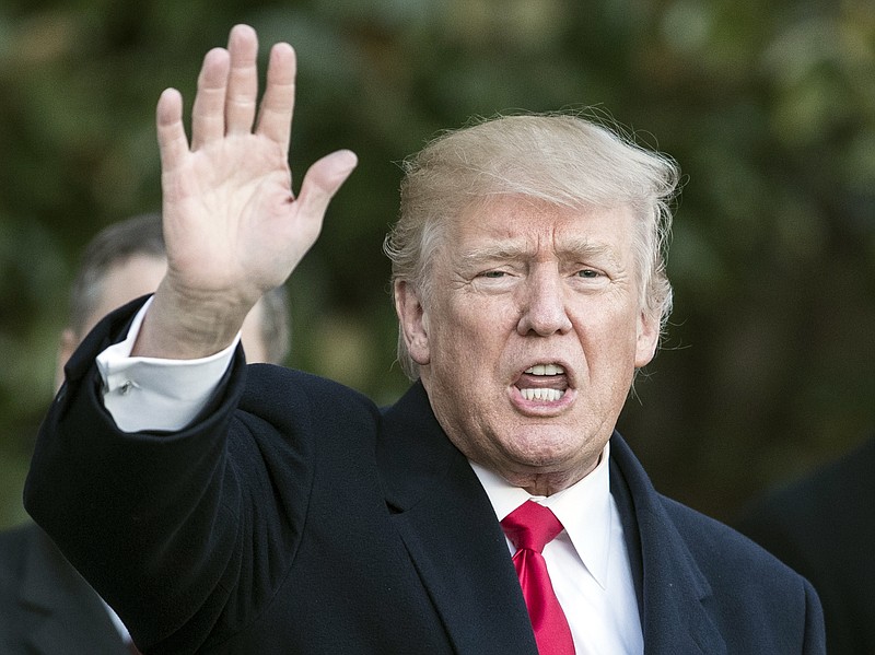 President Donald Trump waves to media as he arrives on Marine One at the White House in Washington, Thursday, Jan. 18, 2018, as he returns from Pittsburgh. (AP Photo/Carolyn Kaster)