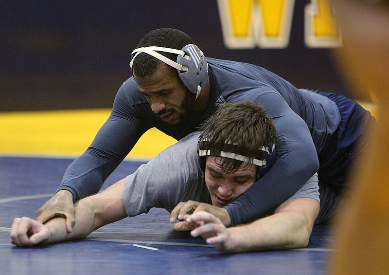 UTC wrestlers Scottie Boykin and Ben Stacey work on drills during practice at Maclellan Gym at the University of Tennessee at Chattanooga on Tuesday, Oct. 31, 2017 in Chattanooga.