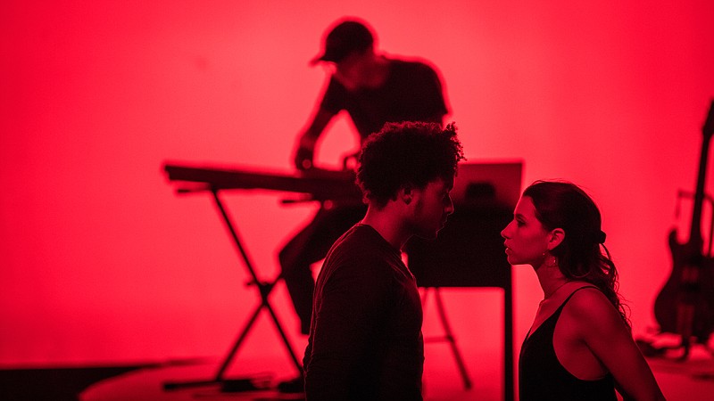 In his new work, "Chaos Theory," videographer Josh McCausland tells the story of a faltering relationship through music and dance. Performers include Q Harper and Erika Leeds, in foreground, with McCausland on keyboard in back.