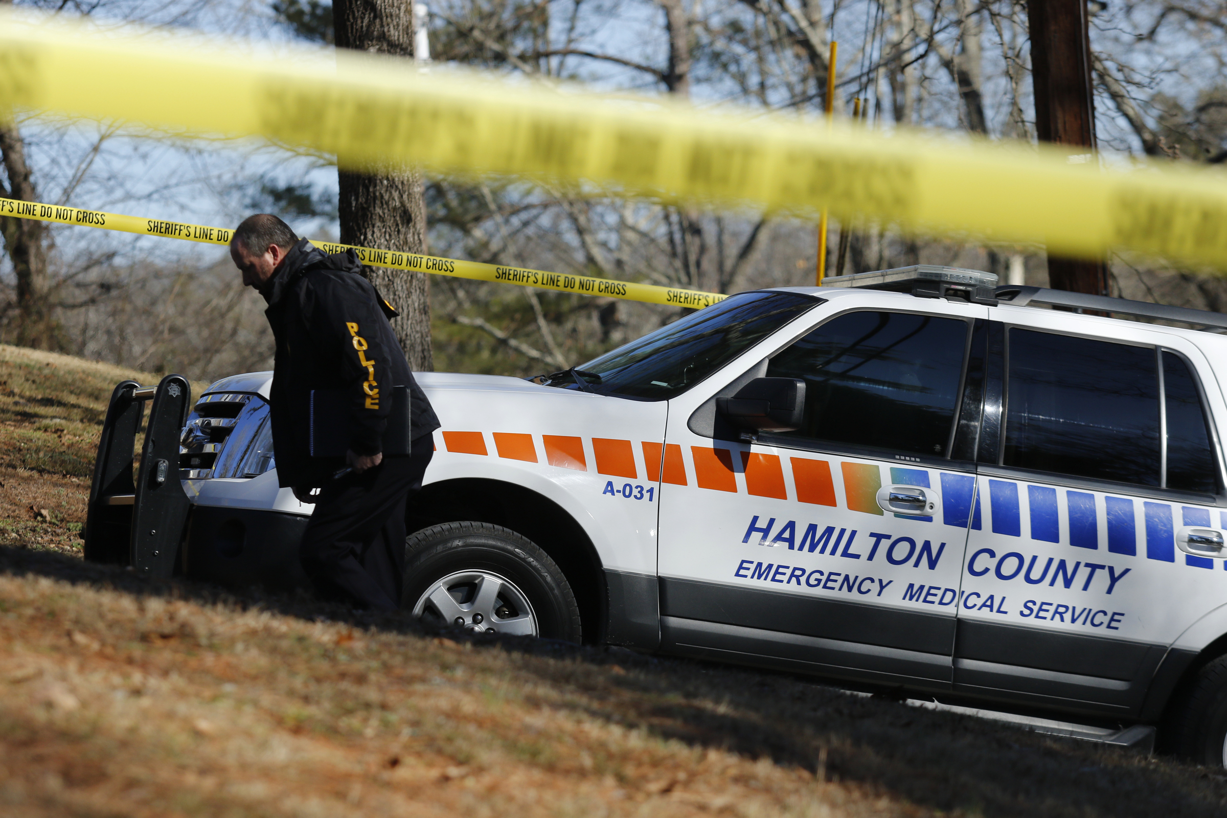 A TBI agent walks up to the scene after a shooting involving a Hamilton County Sheriff's Office deputy on Wilkes Avenue on Friday, Jan. 19, 2018, in Soddy-Daisy, Tenn. TBI is investigating the shooting.