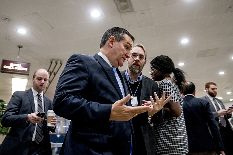 Sen. Ted Cruz, R-Texas, speaks to reporters as he walks towards the Senate as Congress moves closer to the funding deadline to avoid a government shutdown on Capitol Hill in Washington, Thursday, Jan. 18, 2018. (AP Photo/Andrew Harnik)