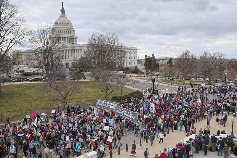 In this Friday, Jan. 27, 2017 file photo, anti-abortion demonstrators arrive on Capitol Hill in Washington during the March for Life, marking the anniversary of the 1973 Supreme Court decision legalizing abortion. Organizers say Donald Trump will become the first sitting president to address the 2018 March for Life gathering, speaking live from the White House. (AP Photo/J. Scott Applewhite)