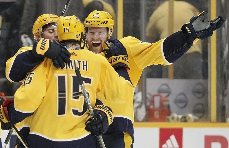 Nashville Predators defenseman Matt Irwin, right, celebrates with right wing Craig Smith (15) after Smith scored the winning goal against the Arizona Coyotes during the shootout in an NHL hockey game Thursday, Jan. 18, 2018, in Nashville, Tenn. The Predators won 3-2. (AP Photo/Mark Humphrey)