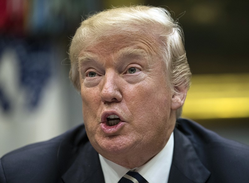 FILE - In this Jan. 11, 2018 file photo, President Donald Trump speaks during a prison reform roundtable in the Roosevelt Room of the Washington. Many parts of the world were shocked by Trump’s vulgar insult of Africa, at least once foreign-language news organizations figured out how to translate the epithet. Japanese media went with translations ranging from simply “filthy” to the more vivid “dripping with excrement.” Chinese state media went with “fenkeng,” which means “cesspit.” And some African outlets decided to use a word meaning “dirty countries” and leave it at that. (AP Photo/Carolyn Kaster, File)