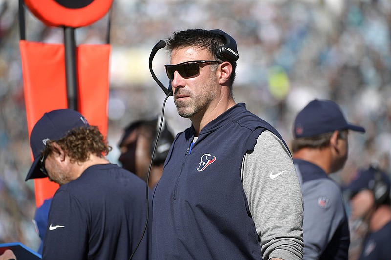 FILE - In this Dec. 17, 2017, file photo, Houston Texans defensive coordinator Mike Vrabel watches from the sideline during the first half of an NFL football game against the Jacksonville Jaguars, in Jacksonville, Fla. The Tennessee Titans have finished interviewing Houston defensive coordinator Mike Vrabel, the first candidate for their head coach opening. The Titans announced they concluded the interview early Thursday afternoon, Jan. 18, 2018. Tennessee is looking to replace Mike Mularkey, fired Monday after he went 21-22 and won the franchise's first playoff game in 14 years. Vrabel is coming off his first season as defensive coordinator for the Texans. (AP Photo/Phelan M. Ebenhack, File)