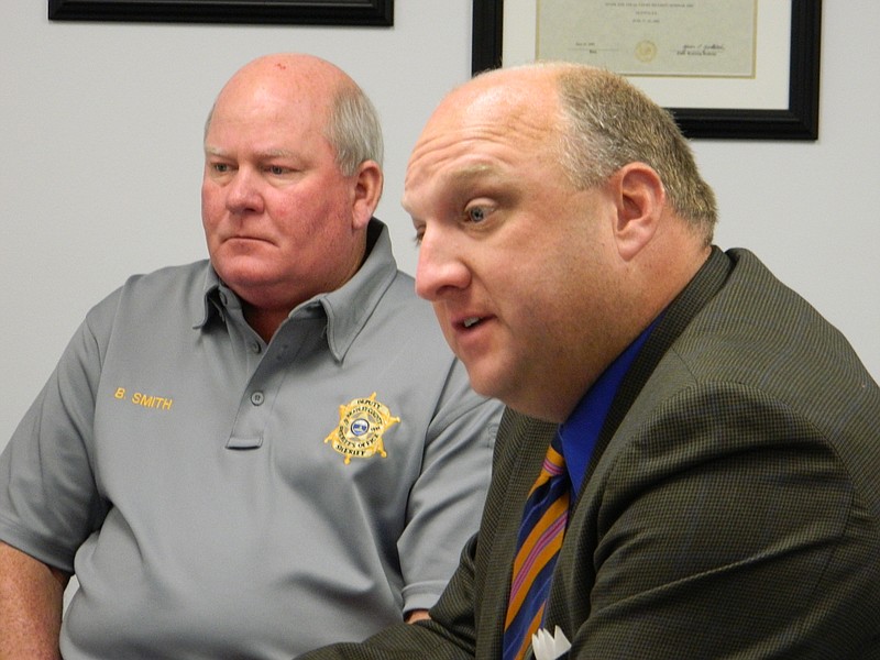 Bradley County Sheriff Eric Watson, right, and Chief Deputy Brian Smith address county commissioners concerning a proposal to create an animal control team of four deputies.