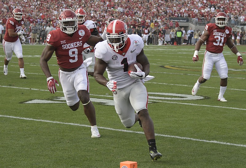 Georgia tailback Sony Michel scores one of his three touchdowns during the 54-48 triumph in double overtime over Oklahoma in the Rose Bowl on New Year's Day.