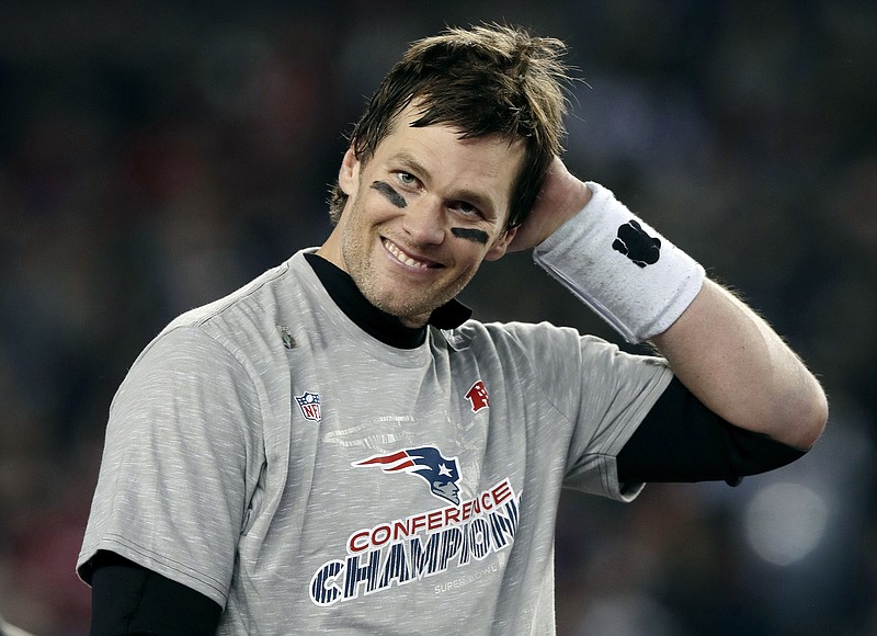 New England Patriots quarterback Tom Brady smiles after winning the AFC championship NFL football game 24-20 over the Jacksonville Jaguars, Sunday, Jan. 21, 2018, in Foxborough, Mass. (AP Photo/Charles Krupa)