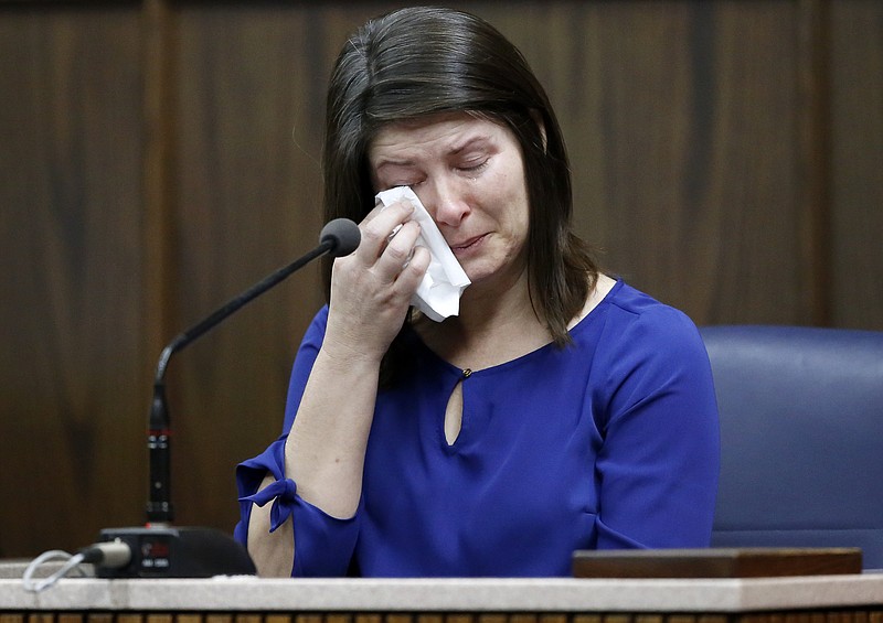Tina Close wipes her eyes as she testifies during Ben Brewer's trial in Judge Don Poole's courtroom in the Hamilton County-Chattanooga Courts Building on Monday, Jan. 22, 2018 in Chattanooga, Tenn. Brewer faces six counts of vehicular homicide after slamming into stopped traffic on Interstate 75 in 2015.
