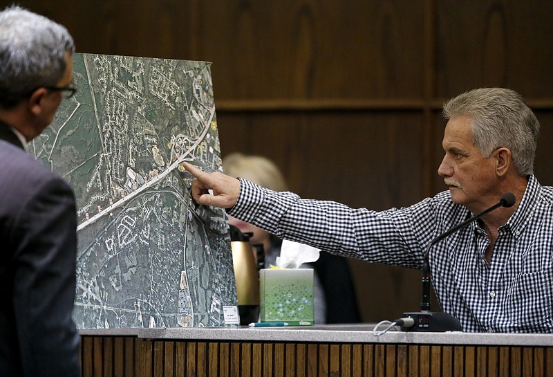 Curtis Caulder, right, points on a map held by Hamilton County District Attorney General Neal Pinkston during the trial of Ben Brewer in Judge Don Poole's courtroom in the Hamilton County-Chattanooga Courts Building on Monday, Jan. 22, 2018 in Chattanooga, Tenn. Brewer faces six counts of vehicular homicide after slamming into stopped traffic on Interstate 75 in 2015.
