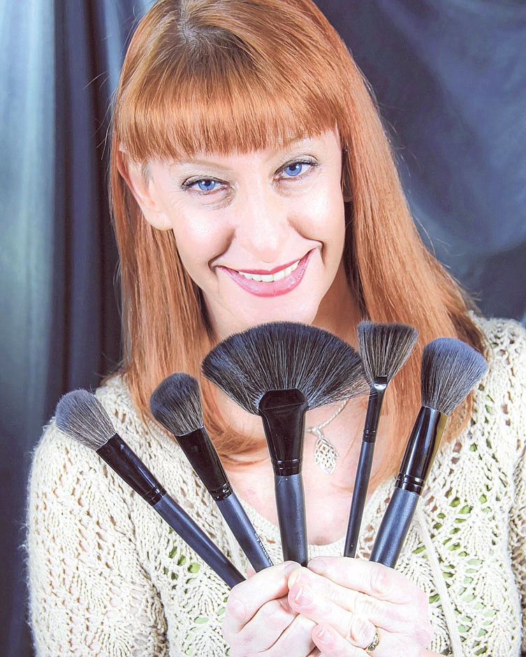 Darla Wigley shows off the tools of the makeup trade.