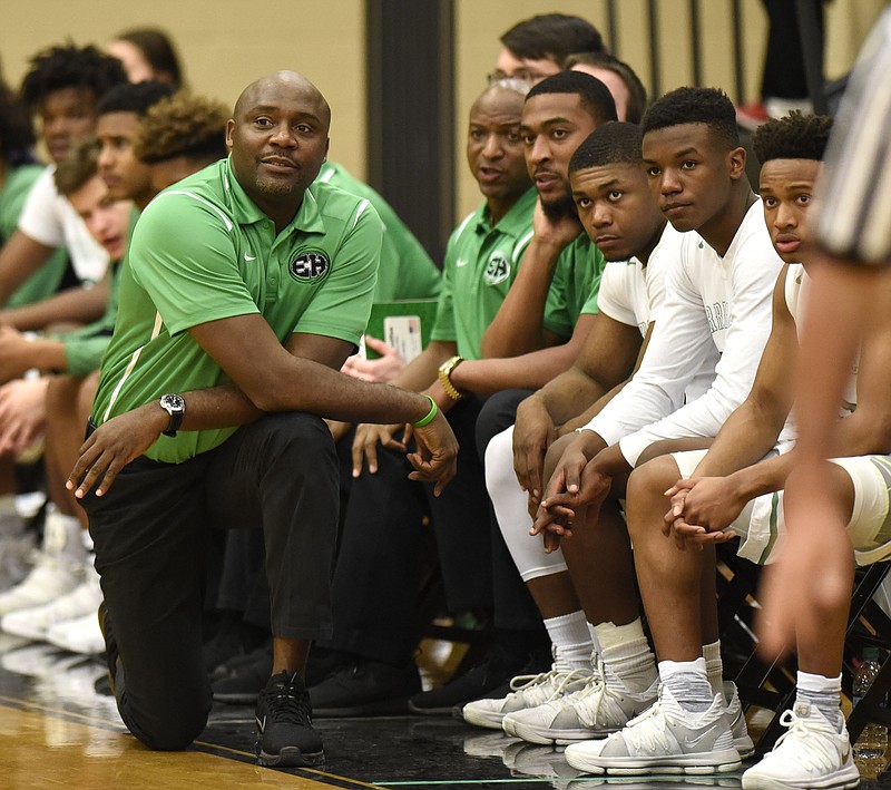 East Hamilton's head coach Rodney English and his bench follow the action. The Tyner Rams visited the East Hamilton Hurricanes in TSSAA basketball action on January 19, 2018.