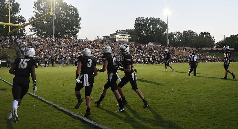 The Bradley Central High School offense comes off the field after a touchdown in front of a packed stadium. The Cleveland Blue Raiders visited the Bradley Central Bears in TSSAA football action on Sept. 15, 2017.