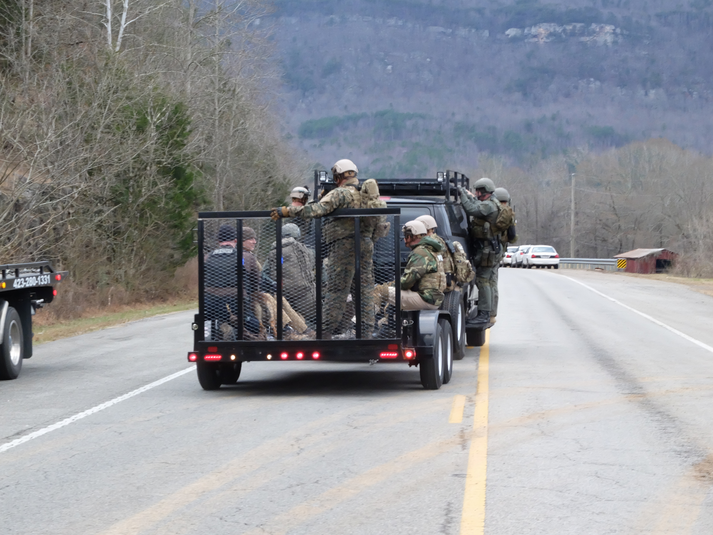 A trailer with law enforcement search teams head back to command after a search of nearby Whitwell on State Highway 283, late Tuesday.