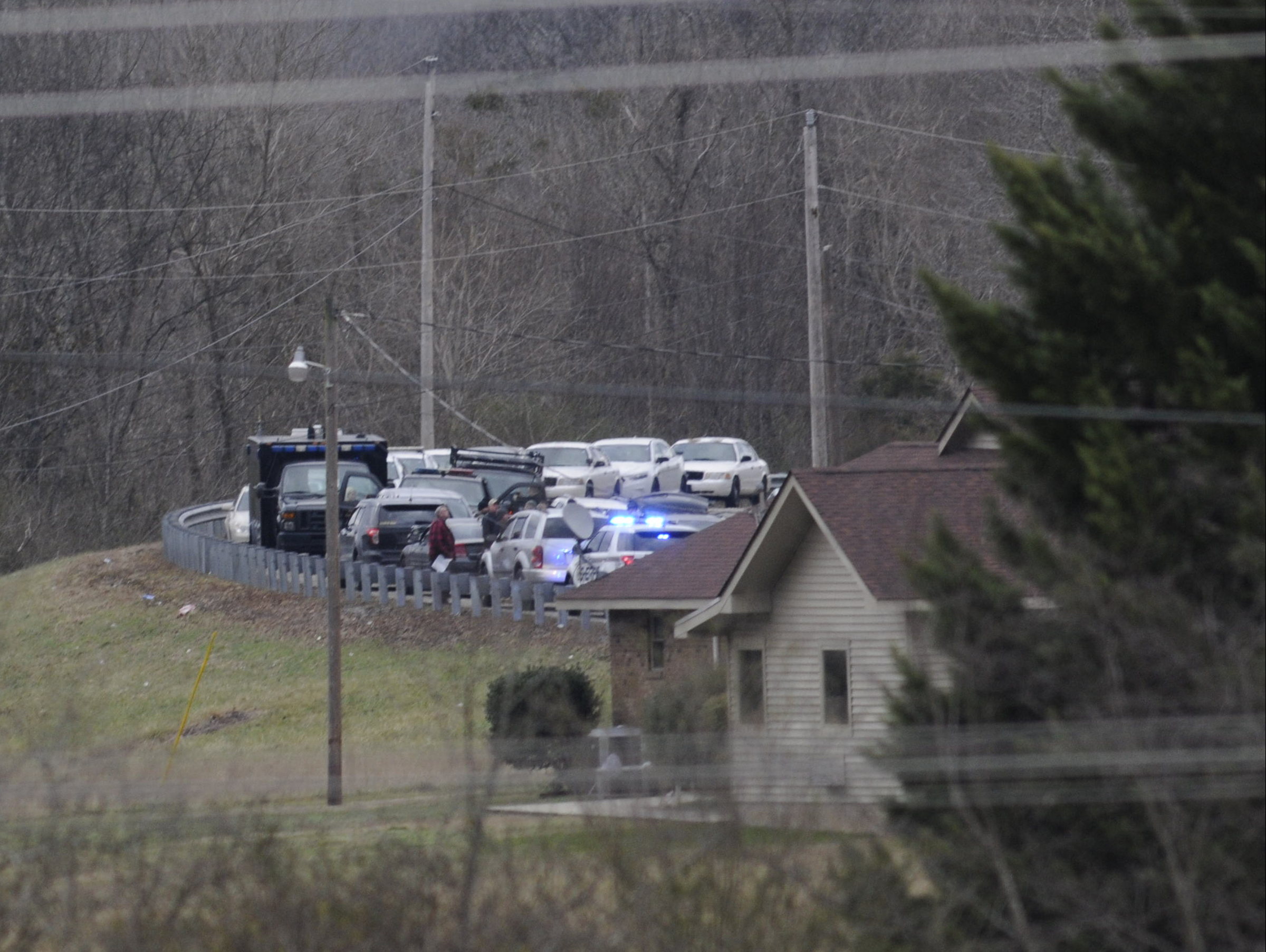 Multiple law enforcement agencies crowd State Highway 283 in this view from Whitwell Elementary School Tuesday afternoon.