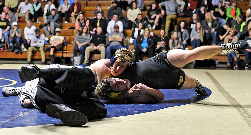 Soddy-Daisy's Ty Boeck (top) works to pin Bradley's Kevin Gentry in the 220 pound class.  The Bradley Central Bears visited the Soddy-Daisy Trojans in TSSAA wrestling action at the Soddy-Daisy Wrestling Arena on January 23, 2018.  