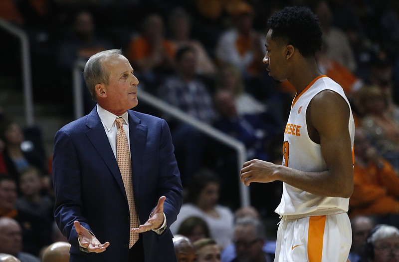 Tennessee head coach Rick Barnes talks with Tennessee guard Jordan Bowden (23) in the second half of an NCAA college basketball game against Vanderbilt on Tuesday, Jan. 23, 2018, in Knoxville, Tenn. (AP Photo/Crystal LoGiudice)