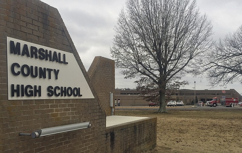 Authorities investigate the scene of fatal school shooting Tuesday, Jan 23, 2018, in Benton, Ky. 