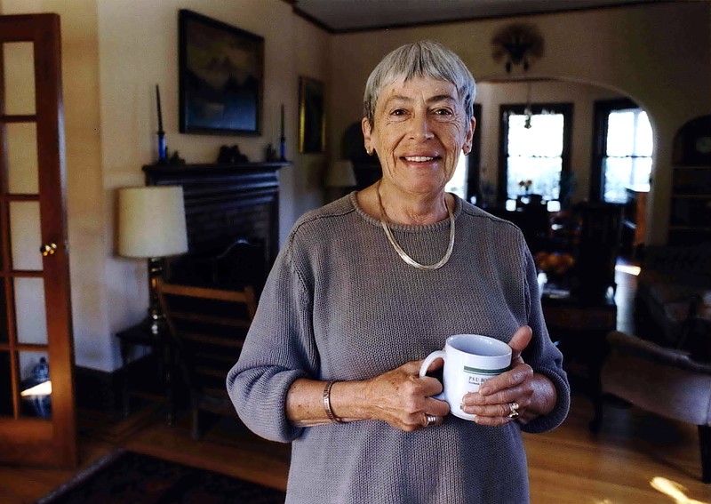 Ursula Le Guin American author of novels, children's books, is seen in a Sept. 9, 2001 photo at home in Portland, Ore. Le Guin, the award-winning science fiction and fantasy writer who explored feminist themes and was best known for her Earthsea books, died peacefully Monday, Jan. 22, 2018, in Portland, Oregon, according to a brief family statement posted to her verified Twitter account. She was 88. (Benjamin Brink/The Oregonian via AP)