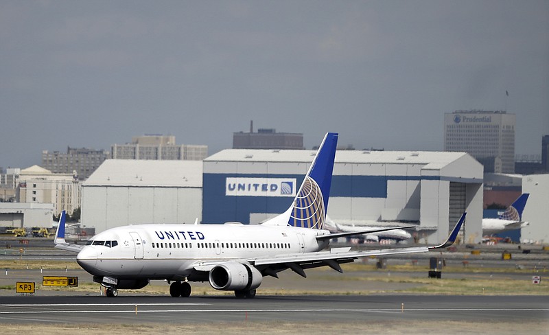 In this Sept. 9, 2015, file photo, a United Airlines jet lands at Newark Liberty International Airport in Newark, N.J. United Continental Holdings, Inc. reports earnings, Tuesday, Jan. 23, 2018. (AP Photo/Mel Evans, file)