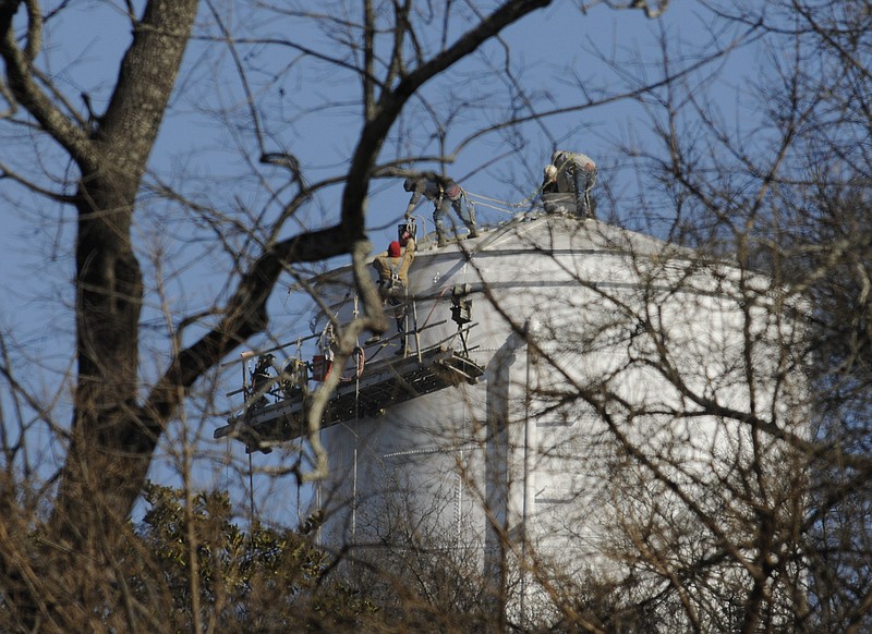 Water tower repair work nears completion atop the Tennessee American Water Company structure Friday in the 200 block of South Crest Road on Missionary Ridge in Chattanooga.