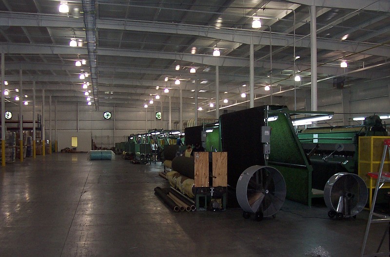 Part of the turf tufting process is pictured at Tarkett in this March 27, 2009 file photo.