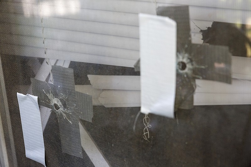 Bullet holes are evident in a Chattanooga home where a teenager was shot in 2016 during a wave of gang violence.