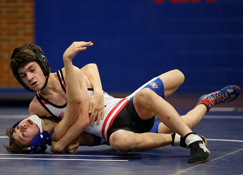 Signal Mountain's Noah Shriner pins Red Bank's Kyle Harper to win the 106-lb bout of their prep wrestling match at Red Bank High School on Friday, Jan. 26, 2018, in Red Bank, Tenn. 