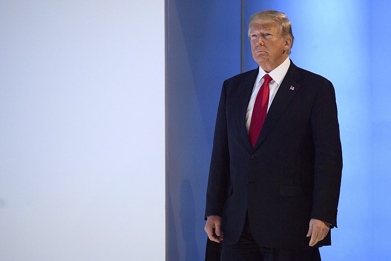 U.S. President Donald Trump, arrives to a plenary session in the Congress Hall on the last day of the annual meeting of the World Economic Forum, WEF, in Davos, Switzerland, Friday, Jan. 26, 2018. (Laurent Gillieron/Keystone via AP)