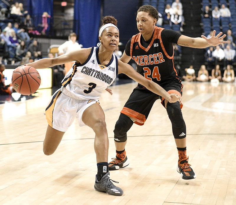 UTC's Mya Long (3) drives to the basket past Mercer's Kahlia Lawrence (24).  The Mercer Bears visited the University of Tennessee Chattanooga Mocs in Southern Conference women's basketball action at McKenzie Arena on January 27, 2018.