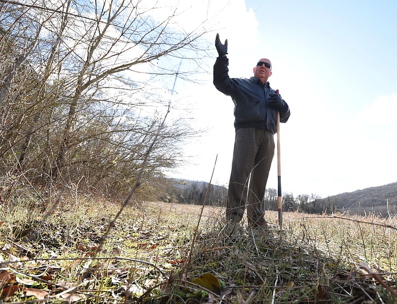 In the Battle Creek area near Interstate 24 and South Pittsburg, Larry Davis, 12th Judicial District Attorney General's Office investigator, stands in a field and talks about the Marion County cold case death he worked years ago. An unidentified man's body was found Dec. 16, 1985, the victim of a homicide that has remained unsolved more than 32 years.