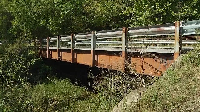 The deteriorated bridge on Standifer Gap Road, which crosses over Friar Branch and has been closed since 2016, will remain closed for at least another two years until funds become available for its replacement, officials say. (Contributed photo by WRCB-TV)