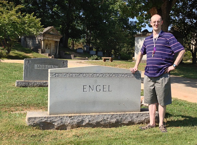 Ryan Lowery visits the grave of Joe Engel, professional baseball player and former owner of the Chattanooga Lookouts, in Forest Hills Cemetery.