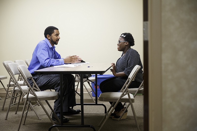 Reggie Madison, left, performs a mock interview with Arielle Nord at a two-day job fair and career readiness program for high school students and recent graduates hosted by First Things First at New Covenant Fellowship Church in 2016.