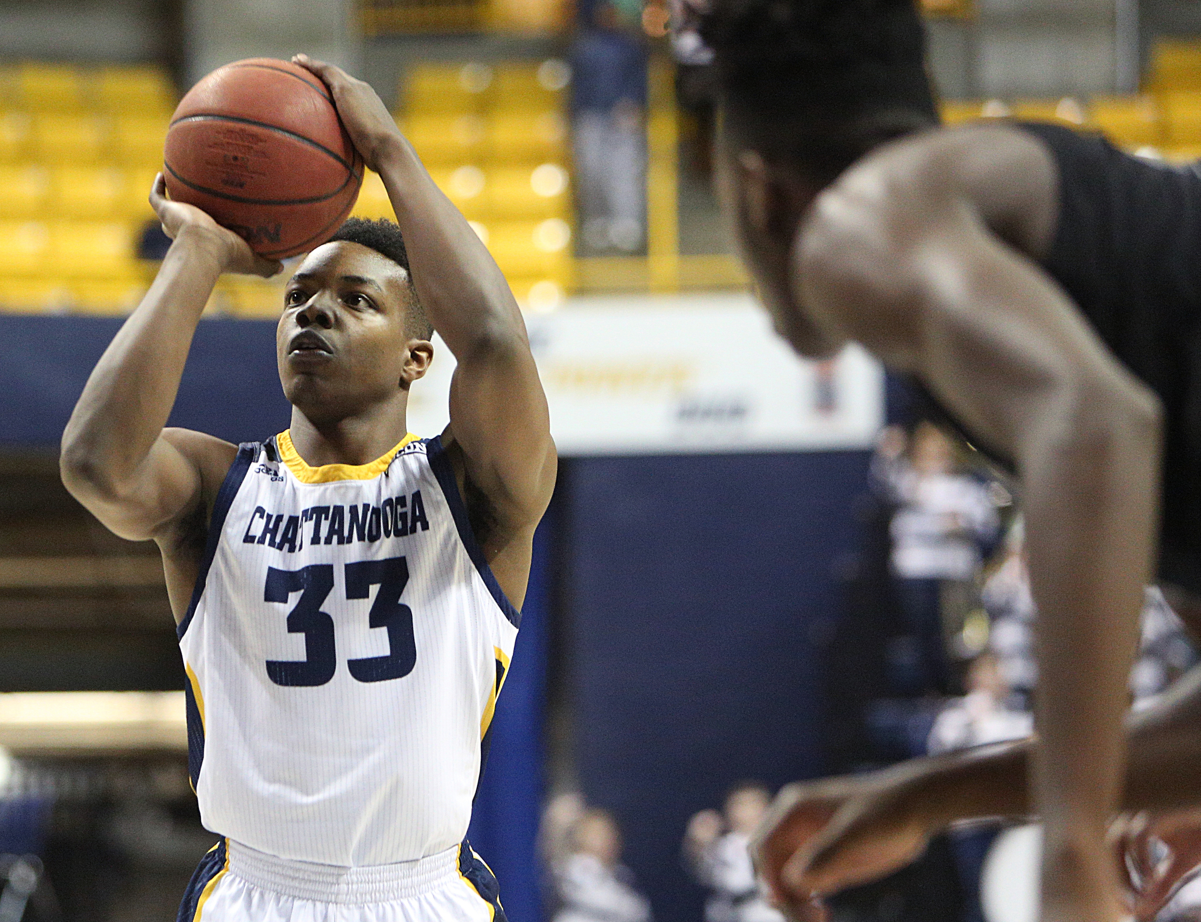 University of Tennessee at Chattanooga's Jonathan Bryant II (33) shoots a free-throw during the UTC vs. University of North Carolina Greensboro men's basketball game Monday, Jan. 29, 2018 at McKenzie Arena at UTC in Chattanooga, Tenn.