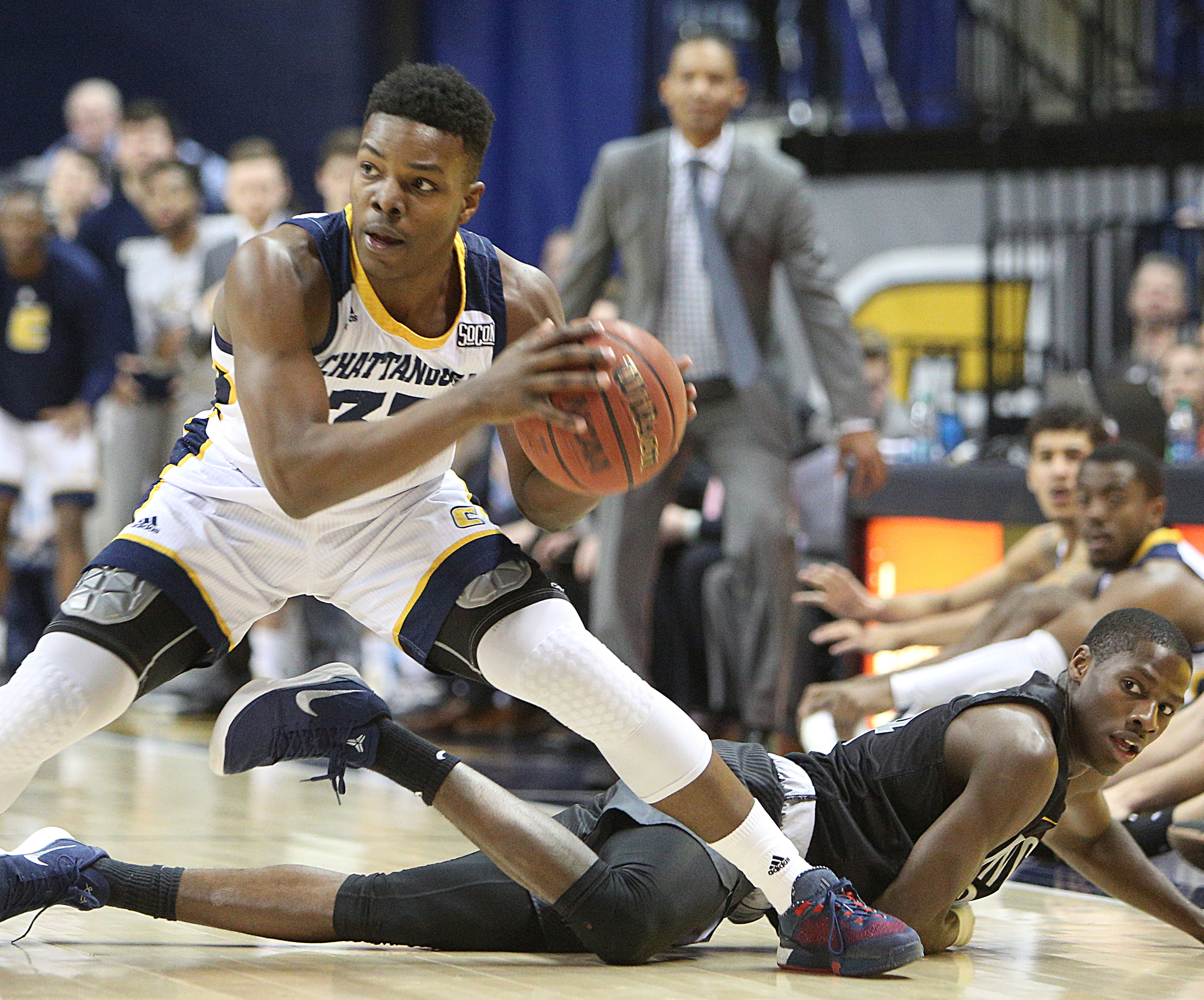 University of Tennessee at Chattanooga's Jonathan Bryant II (33) recovers a loose ball during the UTC vs. University of North Carolina Greensboro men's basketball game Monday, Jan. 29, 2018 at McKenzie Arena at UTC in Chattanooga, Tenn.