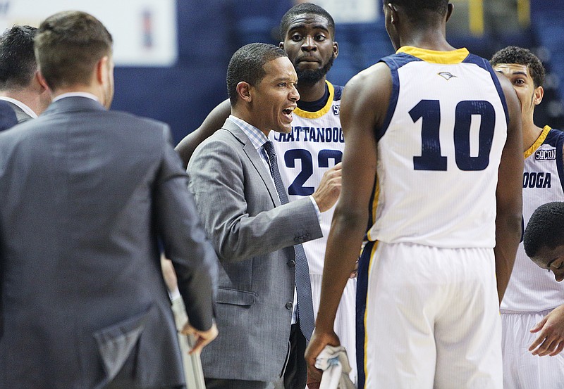 University of Tennessee at Chattanooga men's basketball coach Lamont Paris talks with his team during a game against UNC Greensboro this past January at McKenzie Arena.