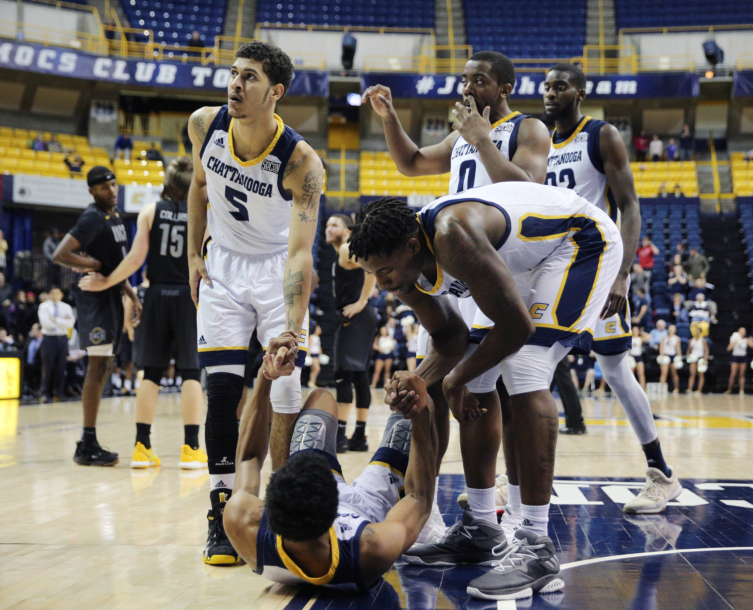 University of Tennessee at Chattanooga's Rodney Chatman (1) draws a foul to UTC a shot at winning in double overtime against University of North Carolina Greensboro men's basketball game Monday, Jan. 29, 2018 at McKenzie Arena at UTC in Chattanooga, Tenn.