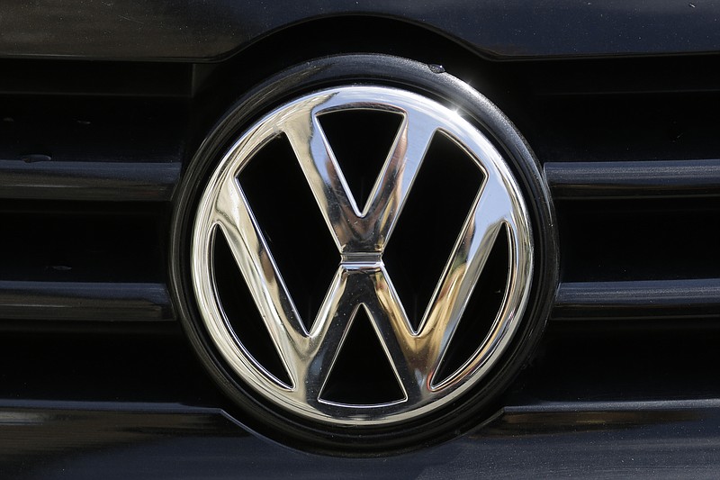 FILE - In this Aug. 1, 2017 file photohe brand logo of German car maker Volkswagen, VW, is photographed on a car in Berlin, Germany. The chairman of Volkswagen says that diesel exhaust tests involving monkeys were "totally incomprehensible" and the matter must be "investigated fully and unconditionally." Monday's comments by Hans Dieter Poetsch, reported by the dpa news agency, come in the wake of a report by the New York Times that a research group funded by auto companies exposed monkeys to diesel exhaust from a late-model Volkswagen, while another group was exposed to fumes from an older Ford pickup. (AP Photo/Markus Schreiber, file)