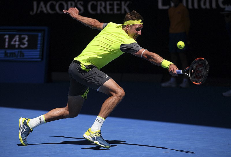United States' Tennys Sandgren reaches for a backhand return to South Korea's Chung Hyeon during their quarterfinal at the Australian Open tennis championships in Melbourne, Australia, Wednesday, Jan. 24, 2018. (AP Photo/Andy Brownbill)