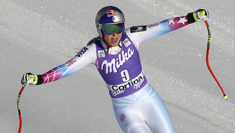 In this Saturday, Jan. 20, 2018, file photo, United States' Lindsey Vonn reacts in the finish area after finishing her run in the women's World Cup downhill ski race in Cortina D'Ampezzo, Italy. Vonn has some unfinished business on her agenda as she heads to the Pyeongchang Olympics. That includes trying to win more medals after missing the last Olympics because of a bad knee. (AP Photo/Alessandro Trovati, File)