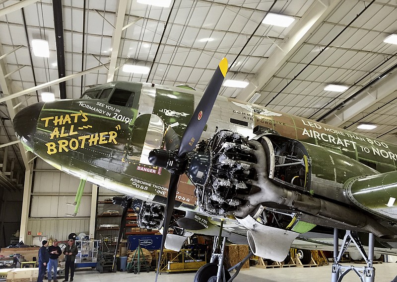 This Thursday, Dec. 14, 2017, photo shows a C-47 called "That's All, Brother," that was discovered and currently being restored at Basler Turbo Conversions in Oshkosh, Wis. The plane carried the first paratroopers who stormed the beaches of Normandy during World War II. The group, Commemorative Air Force, started a campaign to restore the relic with hopes to fly the aircraft over Normandy in 2019 for the 75th anniversary of D-Day.(WLUK/Alex Ronallo, via AP)
