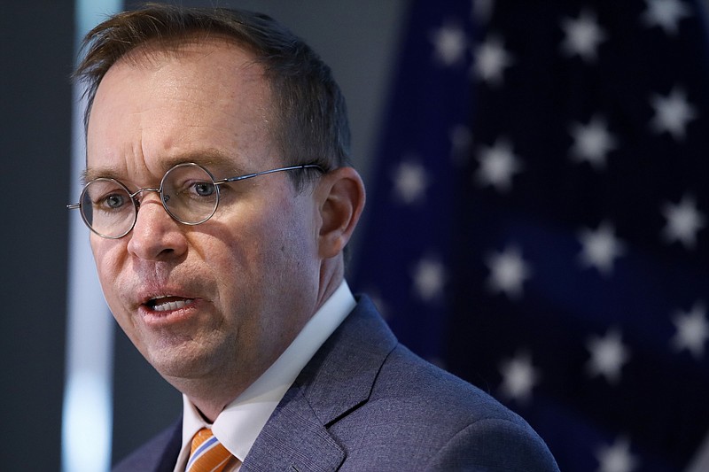 Mick Mulvaney speaks during a news conference after his first day as acting director of the Consumer Financial Protection Bureau in Washington, Monday, Nov. 27, 2017. (AP Photo/Jacquelyn Martin)                                                                                                                                                                                                                    
