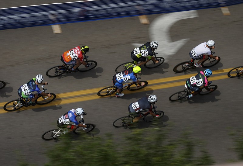 Cyclists compete in the Men's Cat 5 Criterium race of the River Gorge Omnium cycling competition. The three days of races began with time trials on Friday and criterium races on Saturday, and it concludes with road races on Sunday. (Staff photo by Doug Strickland)