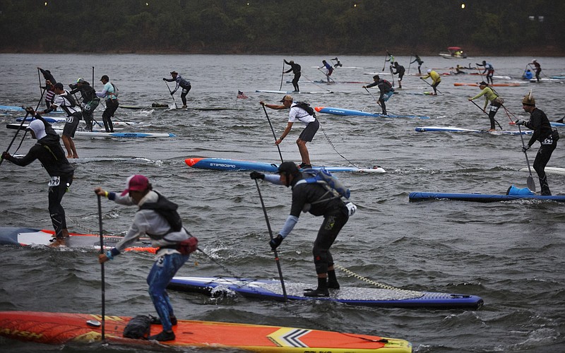 Racers take off from the start for the Chattajack at Ross's Landing. The annual race includes all manner of water-based paddling craft, from standup paddleboards to canoes and surfskis. Racers travel 31 miles along the Tennessee River, from Ross's Landing to Hales Bar Marina near Nickajack Lake. (Staff photo by Doug Strickland)