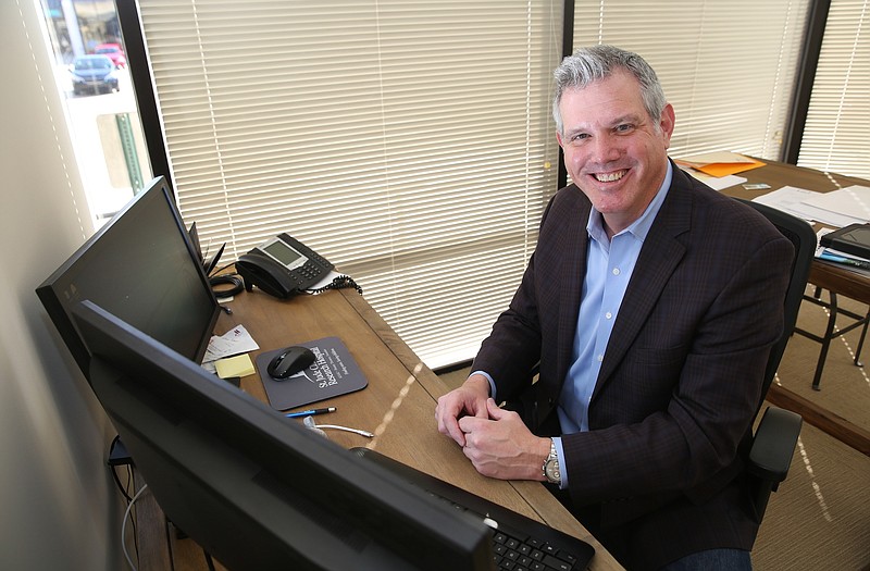 Geoff Ramsey, a real estate agent, poses for a photo at RE/MAX Properties Monday, Dec. 11, 2017 on Shallowford Road in Chattanooga, Tenn. 