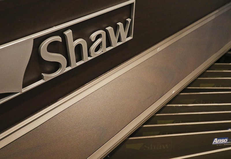 In this Thursday, May 14, 2015, file photo, samples from SHAW and other manufacturers are on display at the Chattanooga Flooring Center off of Shallowford Road in Chattanooga. 